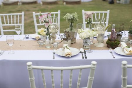Outdoor catering dinner at the wedding with homemade garnishes decorationの写真素材