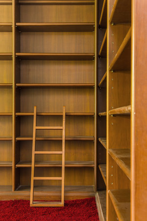 Empty Wooden book Shelf with laddersの写真素材