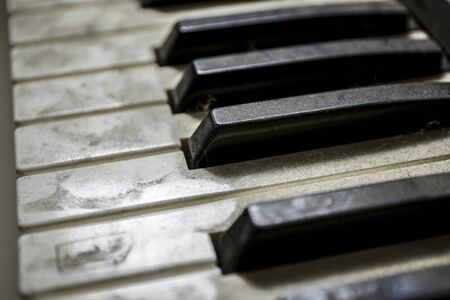 Old unused dusty piano keysの写真素材