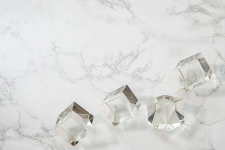 Crystal cubes on white marble backgroundの写真素材