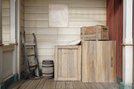 Old vintage wooden cargo boxes in the corner of the storage roomの写真素材