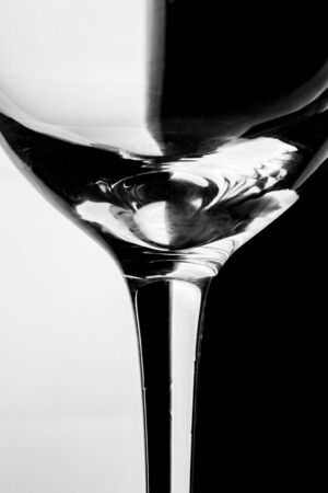 Close up abstract image of wine glass with half shadowの写真素材