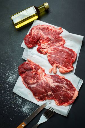 Raw beef steak spider cuts on black backgroundの写真素材