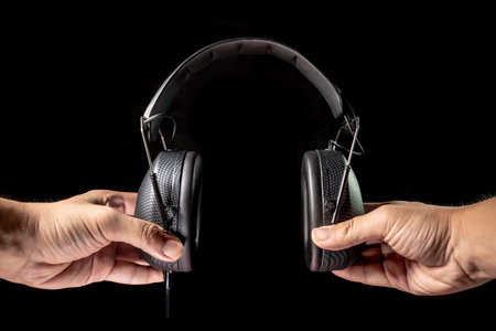Black headphones in dark environment