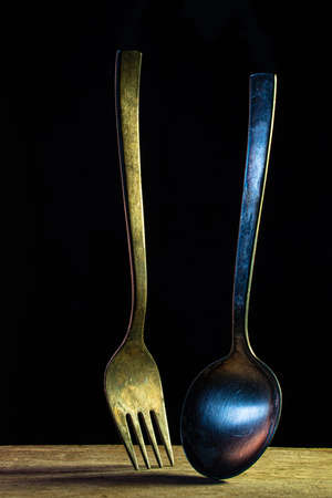 Rusty old fork in dark environmentの写真素材