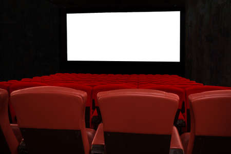 Red seats in theater with white isolated screenの写真素材