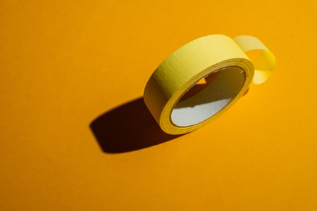 Masking tape on a yellow backgroundの写真素材