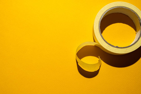 Masking tape on a yellow backgroundの写真素材