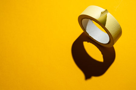 Masking tape on a yellow backgroundの写真素材
