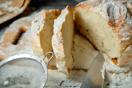 sliced fresh bread on a wooden table