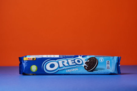 LVIV, UKRAINE - November 27, 2023: packed oreo cookies on a colored background