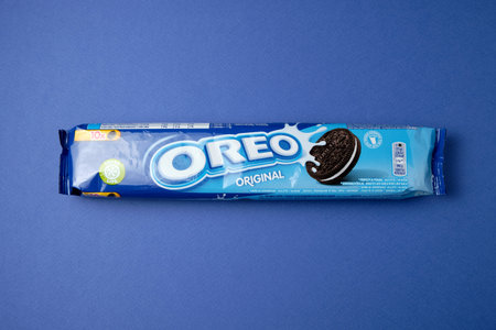 LVIV, UKRAINE - November 27, 2023: oreo cookies in a bag on a blue background