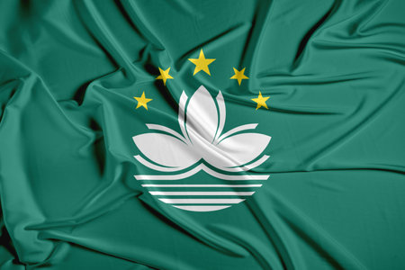 Macau official national flag of silk fabric texture. Waving Fabric Flag of Macauの写真素材