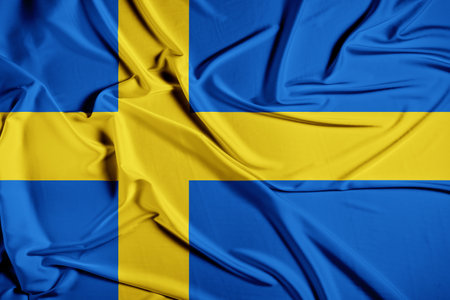 Flag of Sweden. Realistic waving flag of Kingdom of Sweden. Fabric textured flowing flag of Sweden.の写真素材