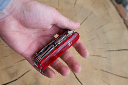 Lviv, Ukraine - February 11, 2024 : Close up photo of victorinox huntsman everyday folding knife