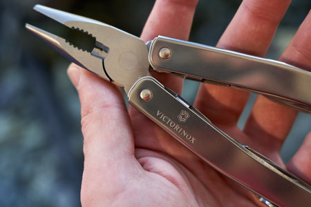Lviv, Ukraine - February 11, 2024 : Close up photo of multitool victorinox spirit silver seriesのeditorial素材