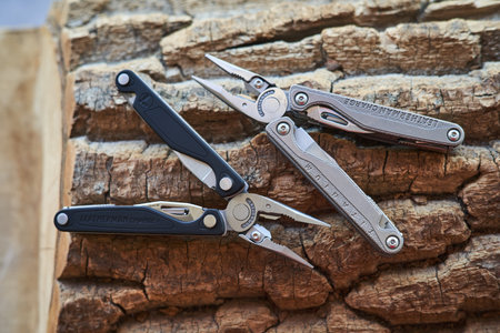 Lviv, Ukraine - February 11, 2024 : Close up photo of multitool leatherman charge black and charge...