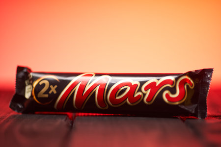 Lviv, Ukraine - February 14, 2024 : Mars chocolate bar on a wooden tableのeditorial素材