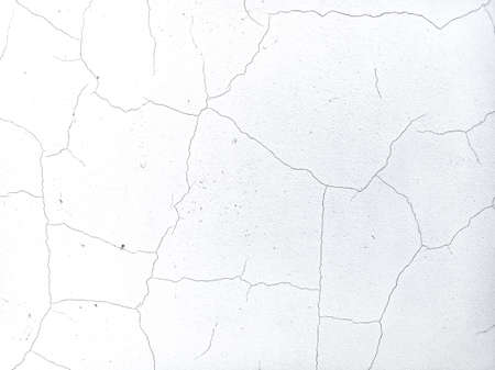 cracks on the wall. wall texture. old plaster. paint on the wall. cracks and scratchesの写真素材