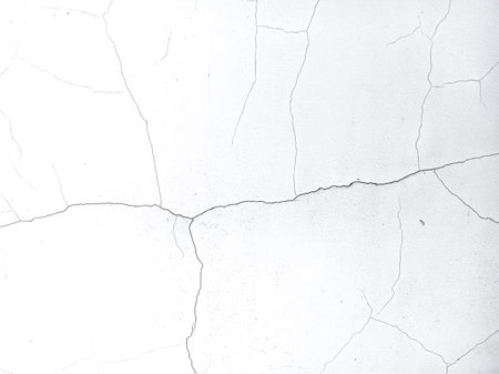 cracks on the wall. wall texture. old plaster. paint on the wall. cracks and scratchesの写真素材