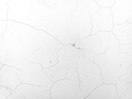 cracks on the wall. wall texture. old plaster. paint on the wall. cracks and scratchesの写真素材