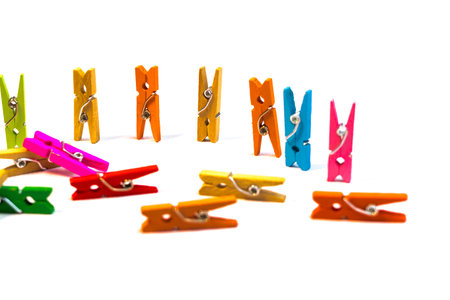 bright colored clothespins. clothespins on a white background. colored bright fingernails.の写真素材