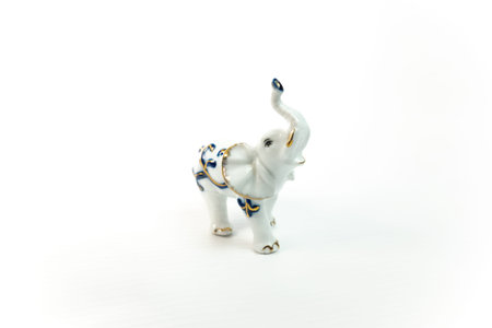 figurines of an elephant. toy elephant. porcelain figurine of an elephant. elephant on a white...