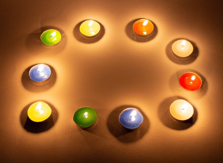 beautiful colored candles. candle fire. decorative colored candles. holidays. romantic mood.の写真素材