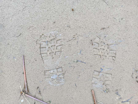 footprints in the sand. footprints in the sand. prints on the shore. shoe mark. footprints in the sand. shoe printの写真素材