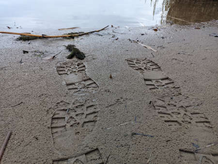 footprints in the sand. footprints in the sand. prints on the shore. shoe mark. footprints in the sand. shoe printの写真素材