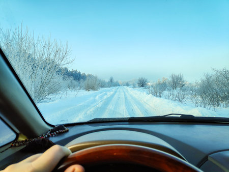 inside the car. driver behind the wheel. drive a car. journey. bad roads. by car. steering wheel and...