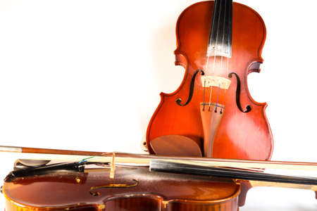stringed musical instruments. violin and bow. playing the violin. music. retro vintage violinの写真素材