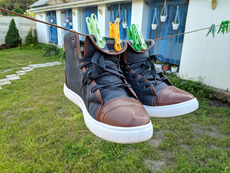 men's footwear. boots. sneakers. feet walk along the road. stroll.の写真素材