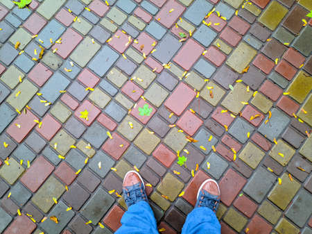 men's footwear. boots. sneakers. feet walk along the road. stroll.の写真素材