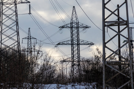 power transmission lines. electrical poles and wires. high-voltage power lines at sunset, high...