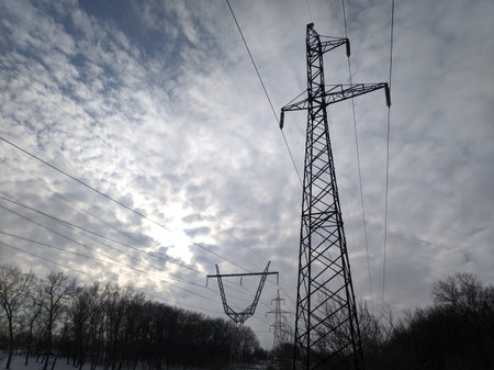 power transmission lines. electrical poles and wires. high-voltage power lines at sunset, high...