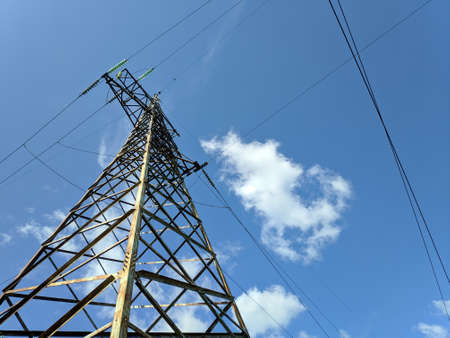 power transmission lines. electrical poles and wires. high-voltage power lines at sunset, high voltage electric transmission tower. High Voltage towers provide power supply over a long distance.の写真素材