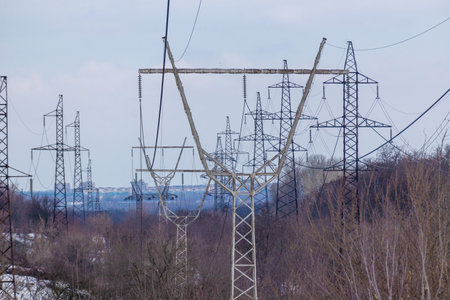 power transmission lines. electrical poles and wires. high-voltage power lines at sunset, high...
