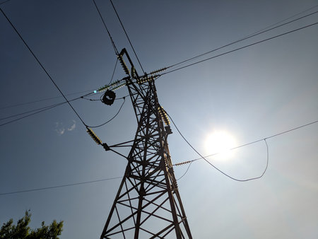 power transmission lines. electrical poles and wires. high-voltage power lines at sunset, high...