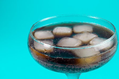 white ice cubes in a transparent glass. ice melts in a glass. transparent ice.の写真素材