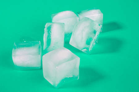 white ice cubes in a transparent glass. ice melts in a glass. transparent ice.の写真素材