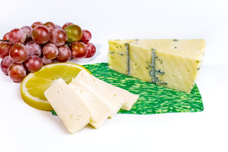 pieces of cheese. slices of hard cheese. pieces of hard cheese isolated on white background. cheese cubes.の写真素材