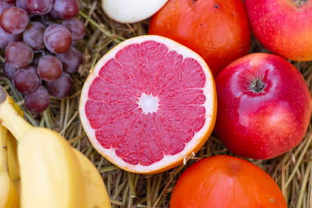 different citrus fruits. lemons, grapes, oranges, tangerines. Plate with different fruits on kitchen...