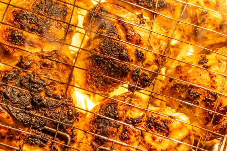 barbecue on the grill. meat on a skewer. cooking meat on fire. Skewers of meat outdoors. Man cooking...