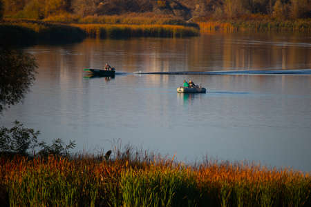 natural landscape with water. sunset and sunrise on the water. beautiful river. lake shore. reflection in the water. water flow. recreation on the shore of the reservoir.の写真素材