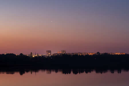 natural landscape with water. sunset and sunrise on the water. beautiful river. lake shore. reflection in the water. water flow. recreation on the shore of the reservoir.の写真素材