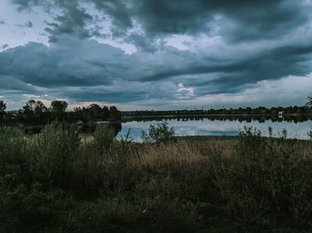 natural landscape with water. sunset and sunrise on the water. beautiful river. lake shore. reflection in the water. water flow. recreation on the shore of the reservoir.の写真素材