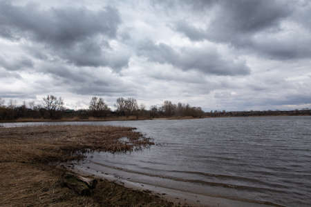 natural landscape with water. sunset and sunrise on the water. beautiful river. lake shore. reflection in the water. water flow. recreation on the shore of the reservoir.の写真素材