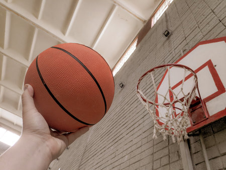 basketball. ball sports. basketball field. basketball player. ball in hand. basketball field and hoopの写真素材
