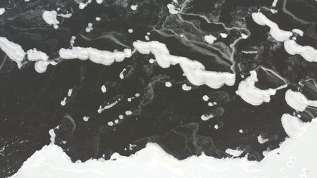landscape with water from above. Aerial view of sandy beach and ocean with waves. Photo taken by a...
